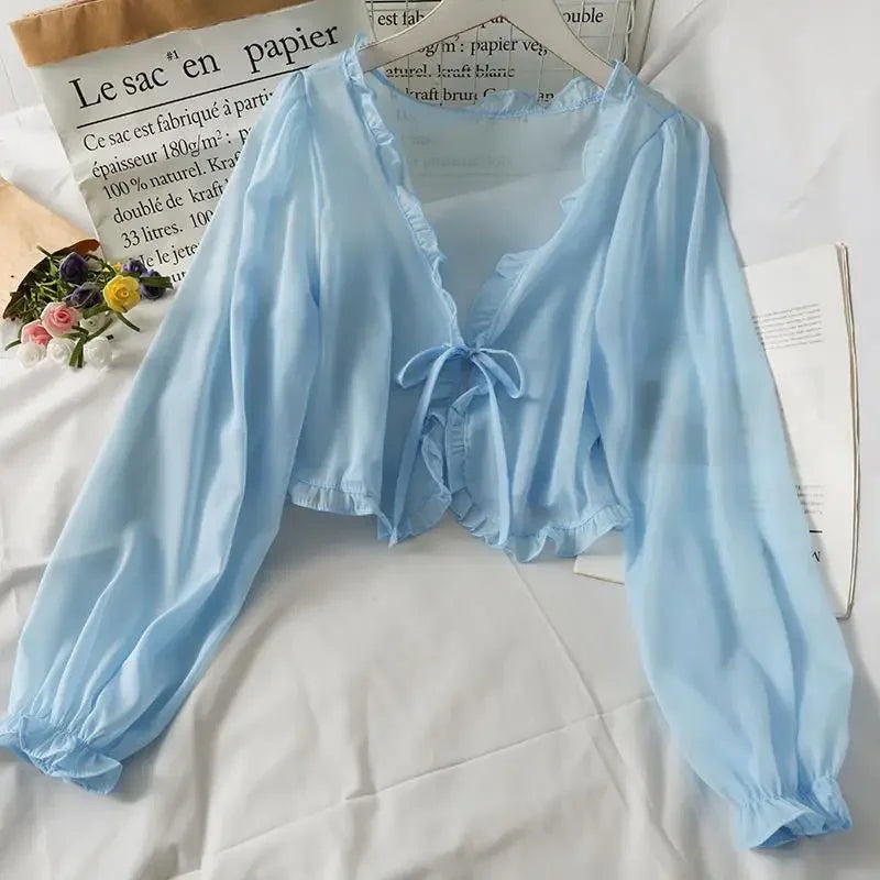 Elegant blus med rosett och spets